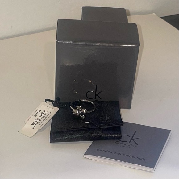 Calvin Klein Jewelry - NWT Calvin Klein Liquid Bubble Dangle Stainless Steal Fidget Spinner Ring NIB